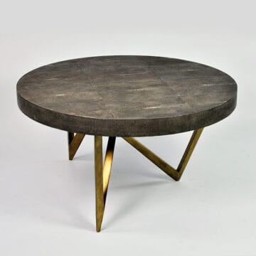 Two round nesting coffee tables with metal legs, featuring shagreen and shell tabletops. Maison Mermont