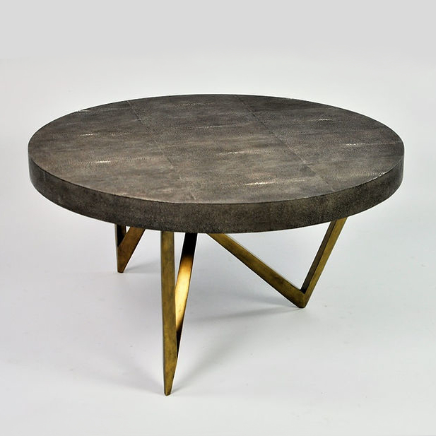 Reef Coffee Table Two round nesting coffee tables with metal legs, featuring shagreen and shell tabletops. Maison Mermont