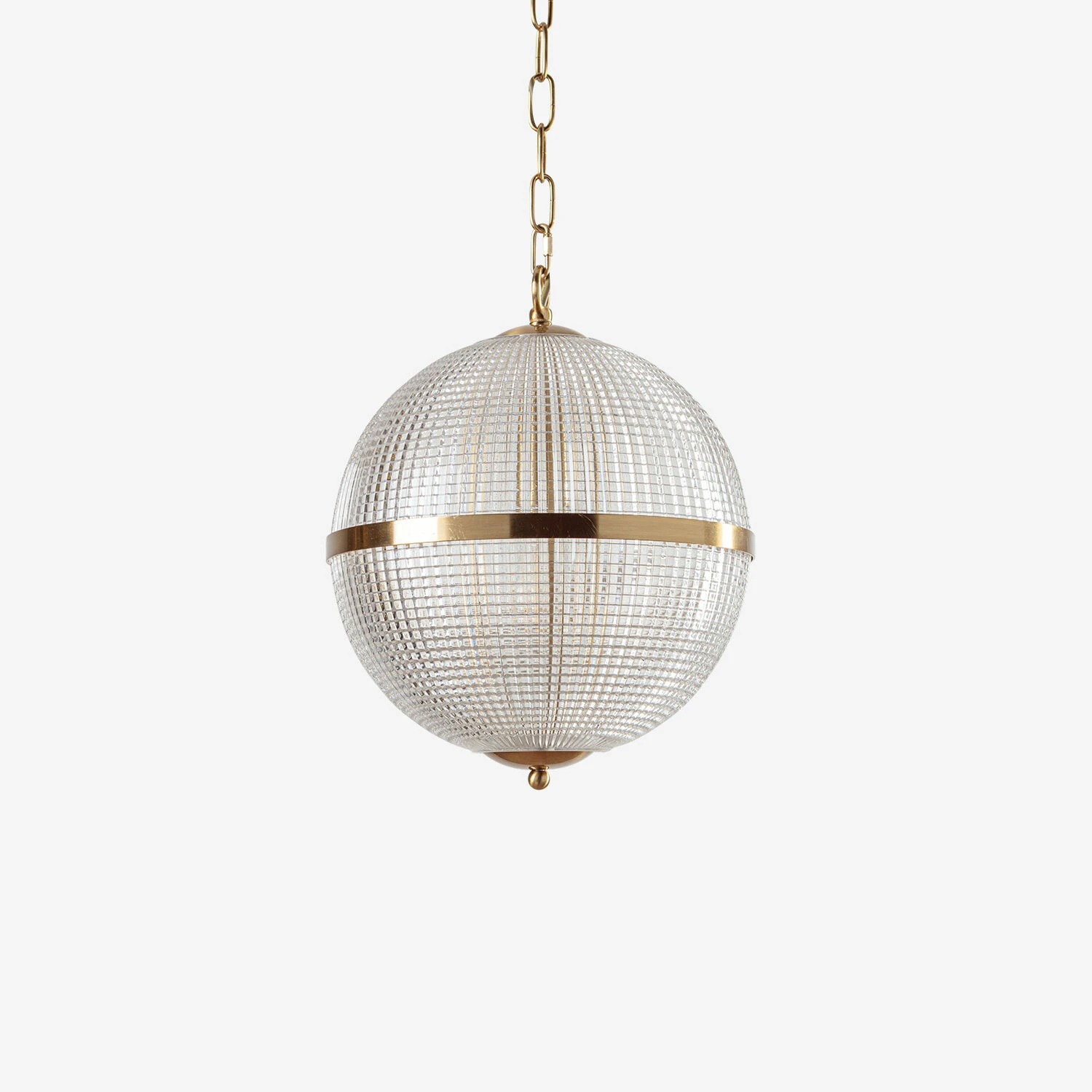 Elegant round pendant light with a gold finish and crystal detailing, perfect for modern interiors. Maison Mermont.